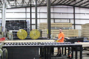 A professional handling material in the warehouse of logistics and distribution company EQ Logistics in Elkhart, IN